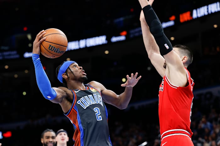 Oklahoma City Thunder guard Shai Gilgeous-Alexander defended by Chicago Bulls center Nikola Vucevic